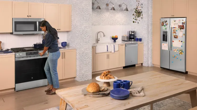 ge-appliances-woman-cooking-on-range